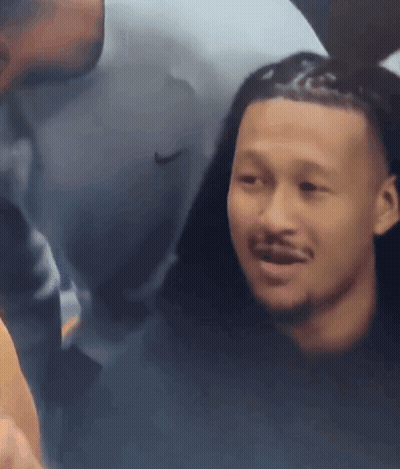 Man In Nike Shirt Looking At Another Man GIF