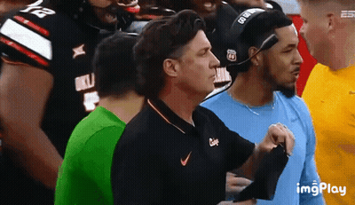 Man In Nike Shirt Standing In Crowd GIF