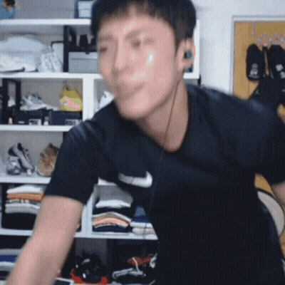 Man In Nike Shirt With Headphones GIF