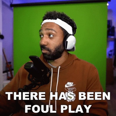 Man In Nike Sweatshirt And Headphones Says There Has Been Foul Play GIF