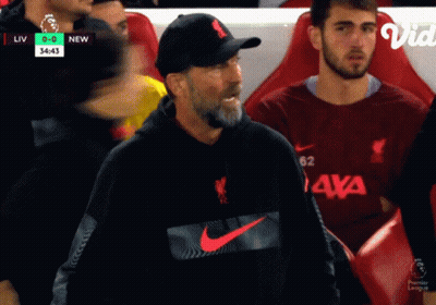 Man In Nike Sweatshirt Sitting In Soccer Stands GIF