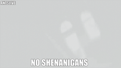 Man In North Face Jacket With No Shenanigans Sign GIF