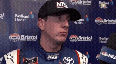 Man In NOS Hat Talking To Reporter GIF