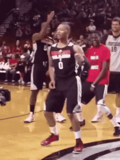 Man in Number 0 Jersey Dancing on Court