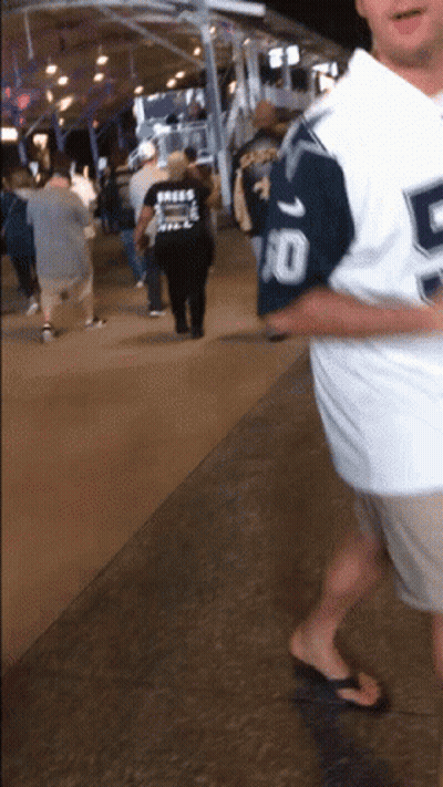 Man In Number 10 Jersey Walking Sidewalk GIF