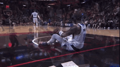 Man In Number 11 Jersey Sitting On Basketball Floor GIF