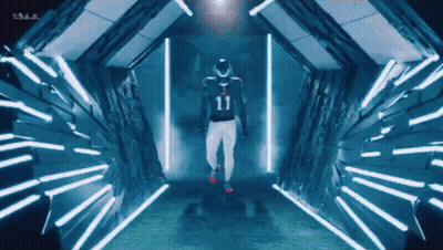 Man In Number 11 Jersey Walking Through Tunnel Of Lights GIF