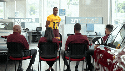Man In Number 17 Jersey At Car Dealership GIF