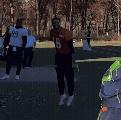 Man In Number 18 Jersey With Players GIF