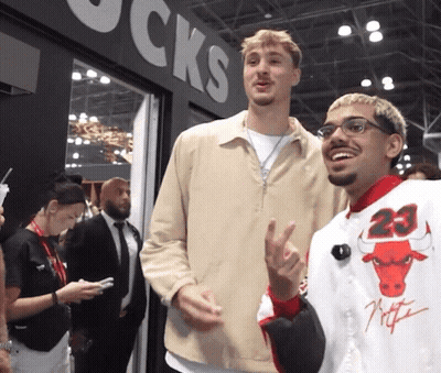 Man In Number 23 Jersey Next To Man With Glasses GIF
