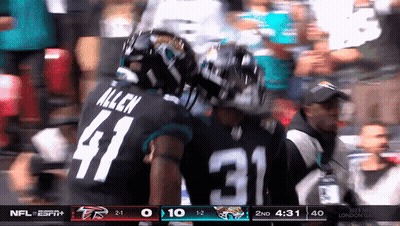 Man In Number 5 Jersey Dancing In Front Of Speaker Saying Come On Jaguars GIF