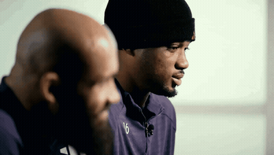 Man In Number 5 Jersey Stands In Crowd GIF
