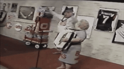 Man In Number 7 Jersey Next To Woman In Number 13 Dress GIF