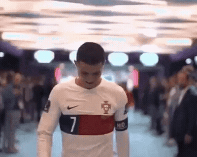 Man In Number 7 Soccer Jersey Walking Through Crowd GIF