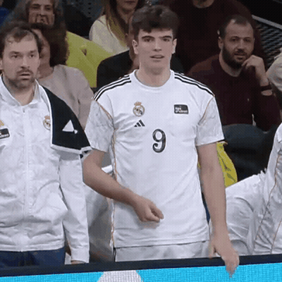Man In Number 9 Jersey Stands In Crowd GIF