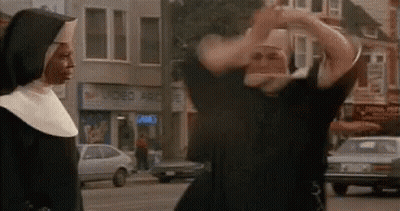 Man In Nun Costume Next To Nun On City Street GIF