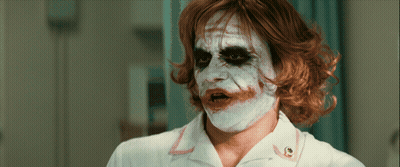 Man In Nurse Uniform With Joker Face Paint GIF