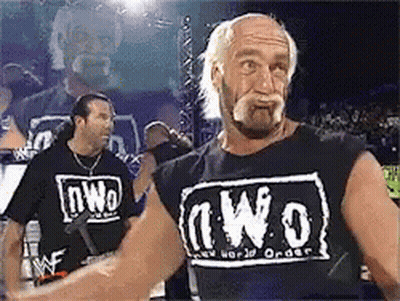 Man In NWO T-Shirt In Crowd GIF