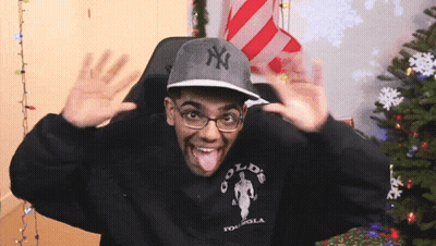 Man In NY Hat And Gold S Gym Sweatshirt Sticking Tongue Out GIF