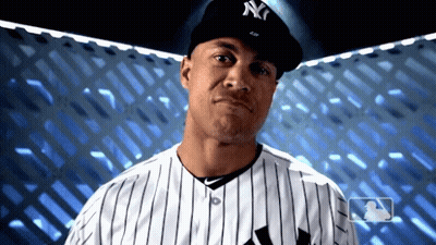 Man In NY Hat Looking Down GIF