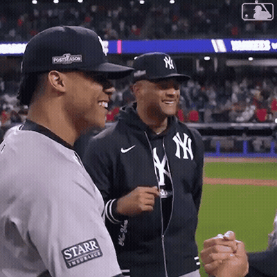 Man In NY Hat Shaking Hands GIF