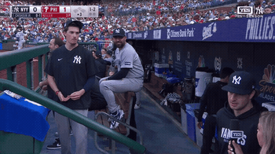 Man In NY Hat Sitting On Stool GIF