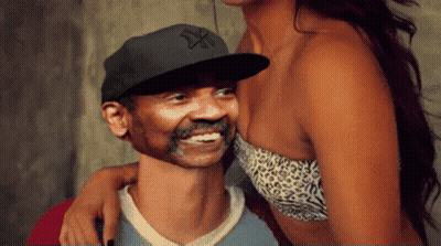 Man In NY Hat Smiling Beside Woman GIF