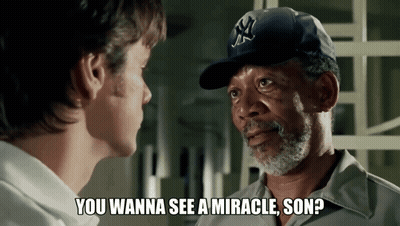 Man In NY Hat Talking To Another Man GIF