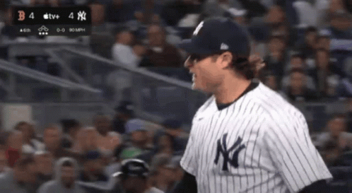 Man In NY Yankees Jersey Standing In Crowd GIF