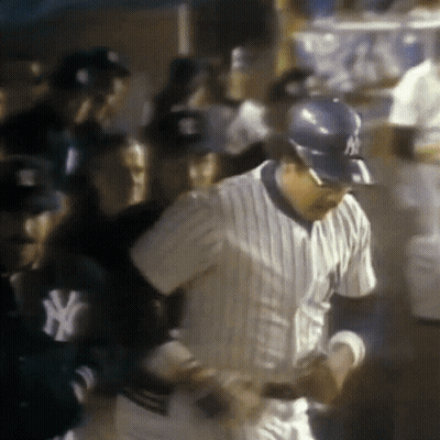 Man In NY Yankees Uniform In Crowd GIF