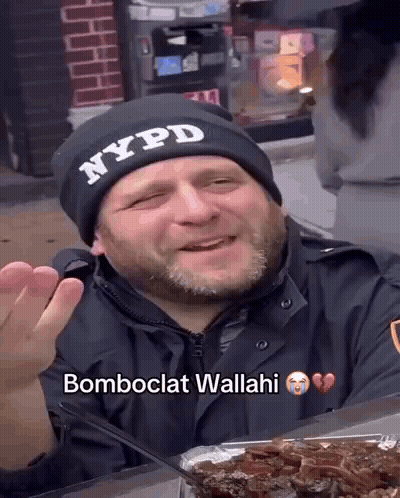 Man In NYPD Hat Sitting At Table With Food GIF