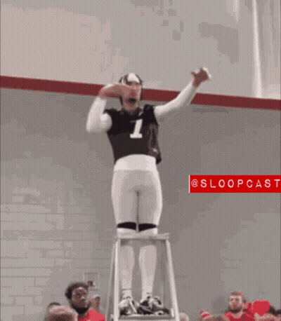 Man In Ohio Jersey Standing On Ladder In Front Of Crowd GIF