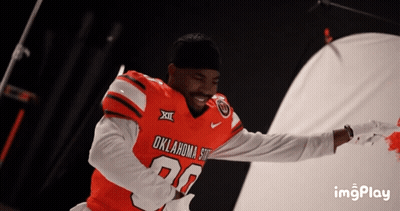 Man In Oklahoma State Football Jersey Smiling GIF