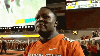 Man In Oklahoma State Jersey On Field GIF