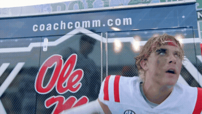 Man In Ole Miss Jersey In Front Of Coachcomm Truck GIF
