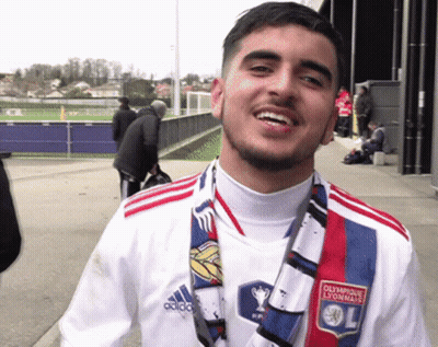 Man In Olympique Lyonnais Shirt And Scarf Smiling GIF