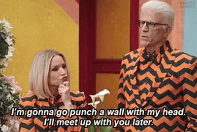 Man In Orange And Black Striped Suit With Woman GIF