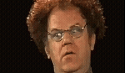 Man In Orange And Blue Sweater Making Funny Face GIF