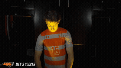 Man In Orange And Gray Striped Jersey Number 16 GIF