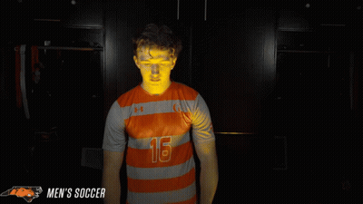 Man In Orange And Grey Striped Shirt Number 16 GIF