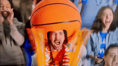 Man In Orange Basketball Costume Holding Trophy GIF