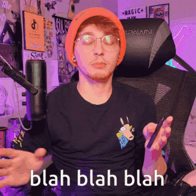 Man In Orange Beanie And Glasses Sitting In Spawn Chair GIF