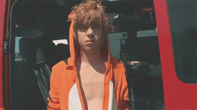 Man In Orange Fox Hoodie Standing In Red Van GIF