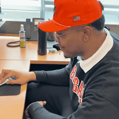 Man In Orange Hat And Black Sweater Saying BGA GIF