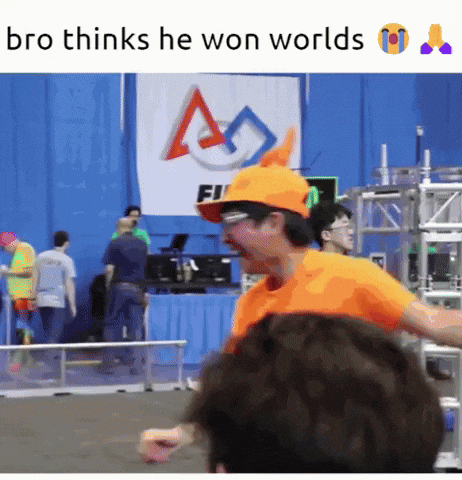 Man In Orange Hat And Glasses Standing In Front Of Sign Saying Fi GIF