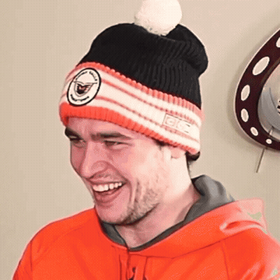 Man In Orange Hoodie And GFC Beanie GIF