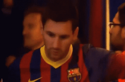Man In Orange Jacket Helping Man In Qatar Shirt GIF