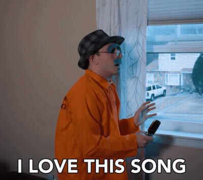 Man In Orange Jacket Saying I Love This Song GIF