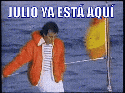 Man In Orange Jacket Standing In Water GIF