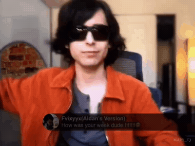 Man In Orange Jacket Talking GIF